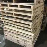 Stack of wooden pallets in a warehouse