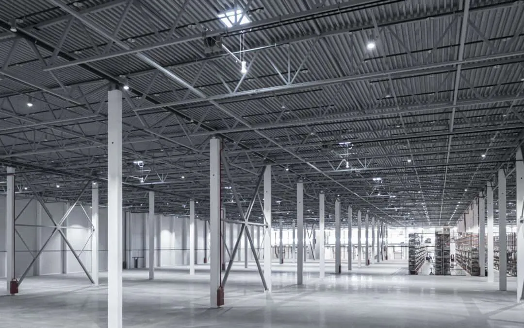 Modern industrial warehouse interior with overhead lighting